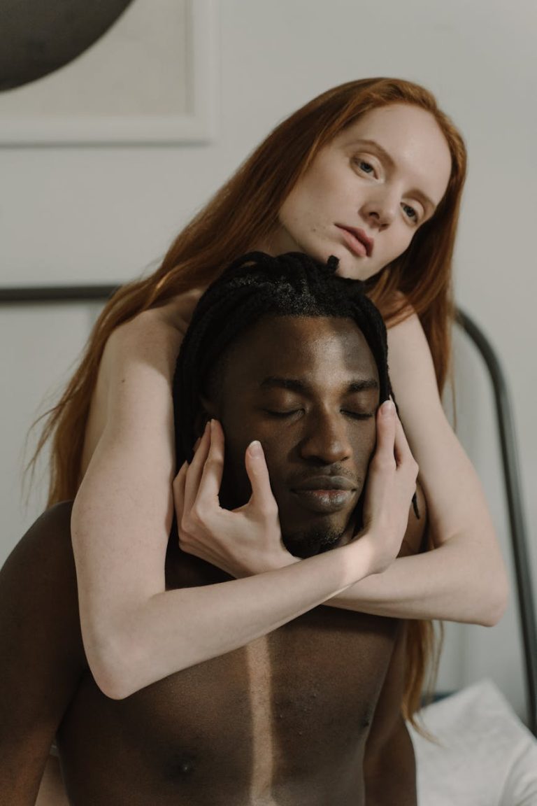 A close and intimate moment featuring an interracial couple showing deep connection.