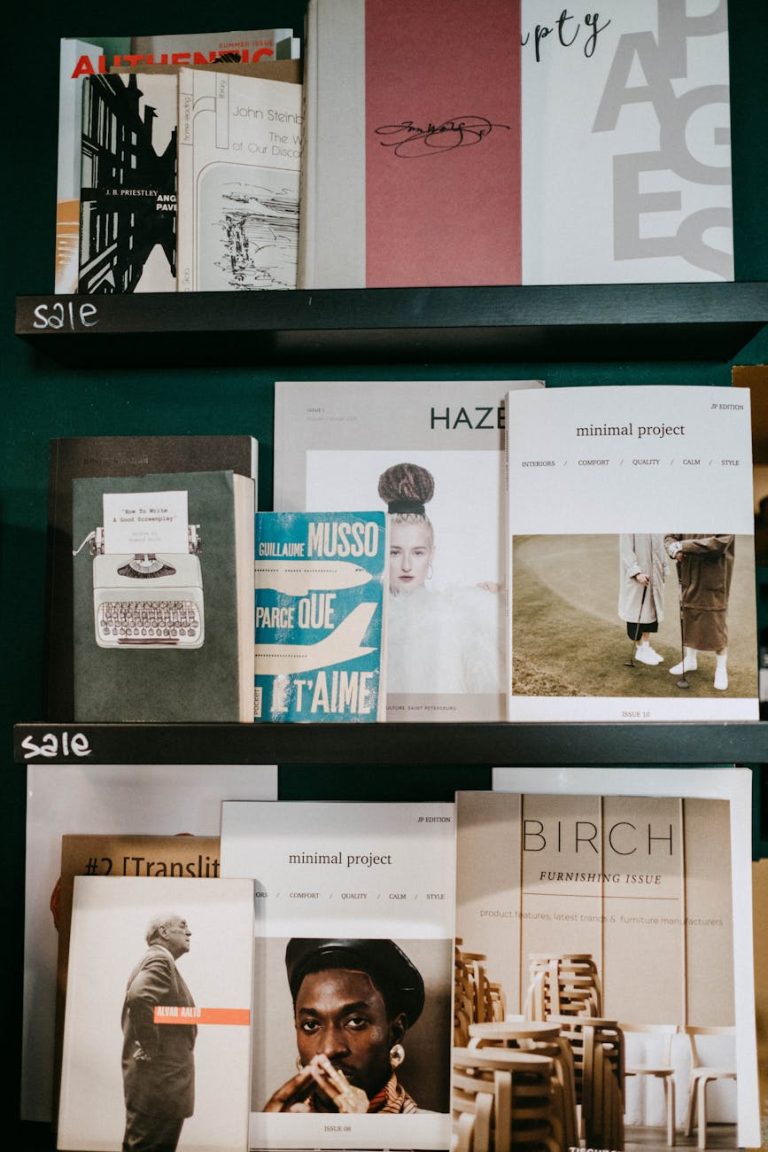 A bookshelf displaying an assortment of modern magazines and books in a stylish indoor setting.