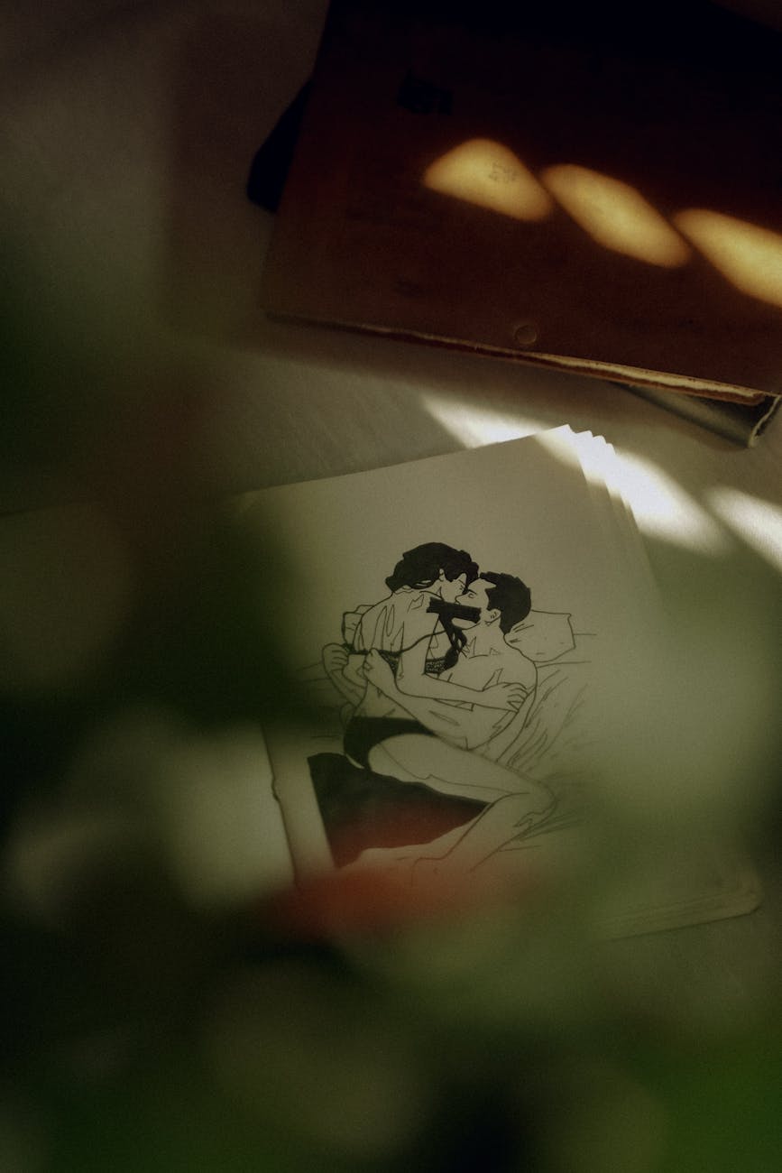 A vintage drawing of a couple sharing an intimate moment, captured in ethereal light and shadow.